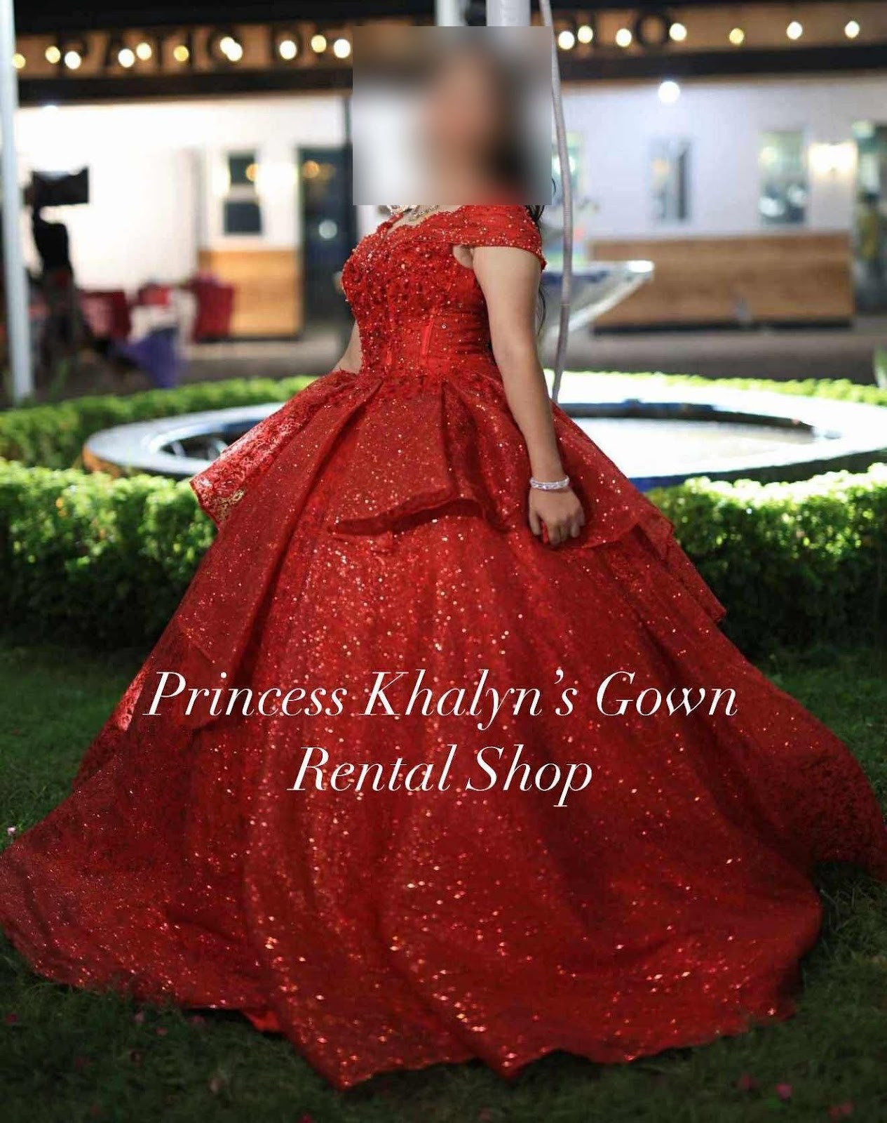 A lavish red ball gown adorned with sparkling embellishments, featuring a fitted bodice and a voluminous skirt, perfect for grand occasions.